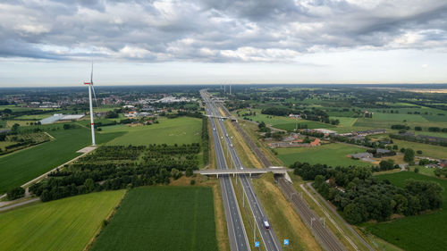 Brecht, belgium, aerial view of wind farm or wind park, with high turbines with the motorway aside