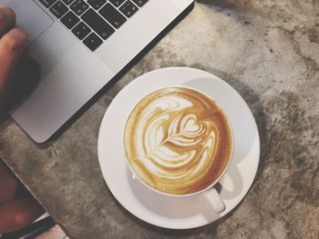 High angle view of coffee cup on table