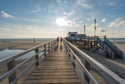 Pier over sea against sky