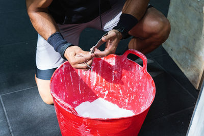 Cropped hand of man washing hands