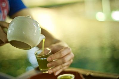 Close-up of woman hand holding drink