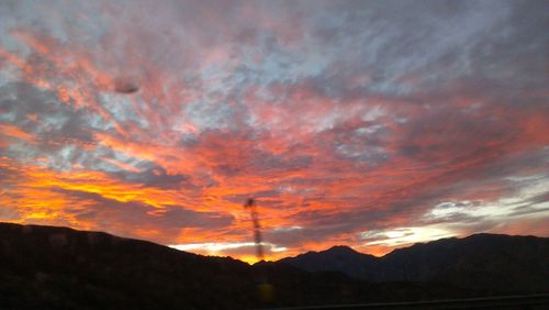 Low angle view of dramatic sky during sunset