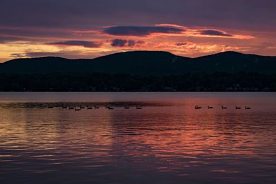 Scenic view of lake against sky during sunset