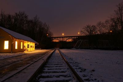 Railroad tracks in winter at night