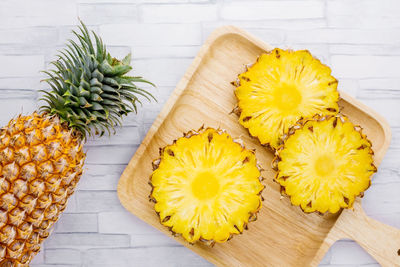 High angle view of yellow flowers on table