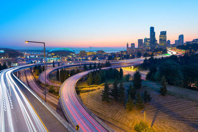 High angle view of light trails on road in city