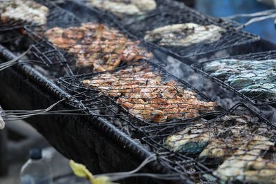 High angle view of meat on barbecue grill