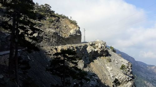 Low angle view of rock formation against sky