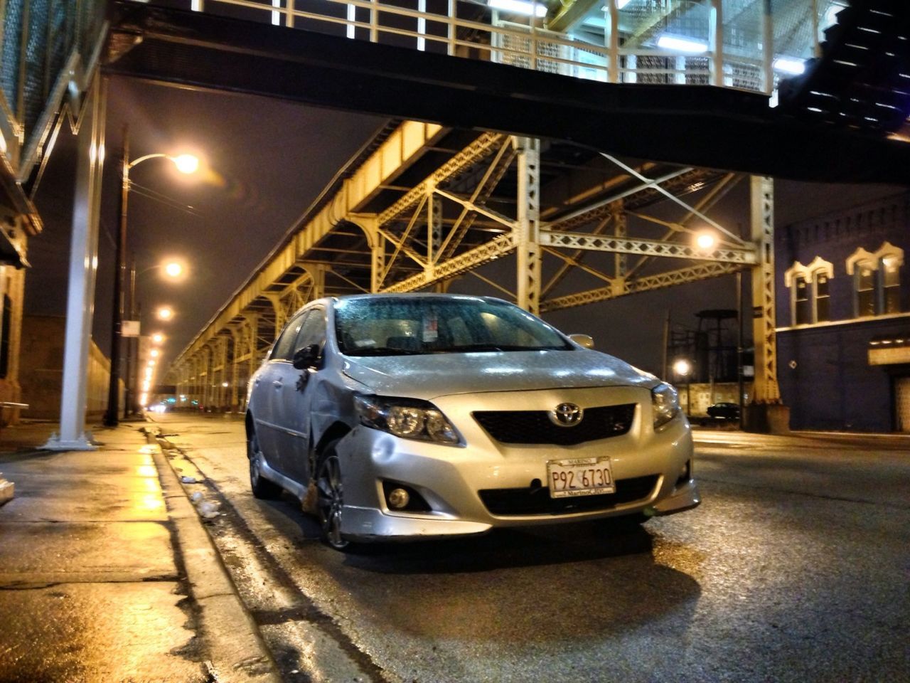 transportation, illuminated, architecture, built structure, night, mode of transport, land vehicle, car, city, building exterior, street, public transportation, railroad track, railroad station platform, road, lighting equipment, outdoors, travel, connection, street light