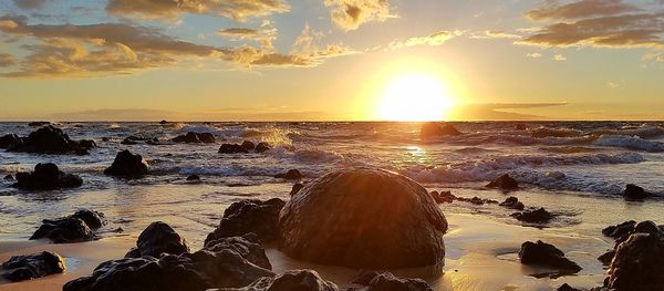 Scenic view of sea against sky during sunset