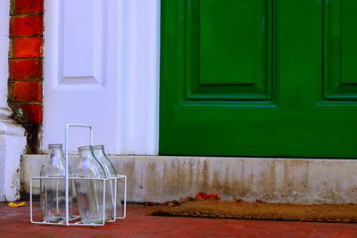 Empty milk bottles in container