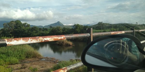 Reflection of trees in lake against sky