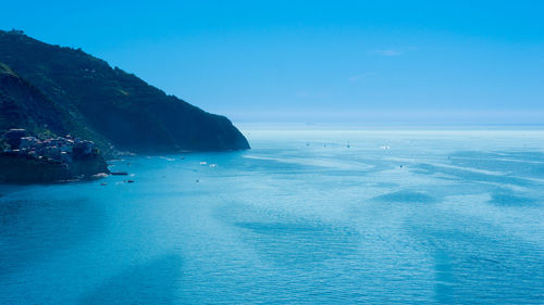 Scenic view of sea against blue sky