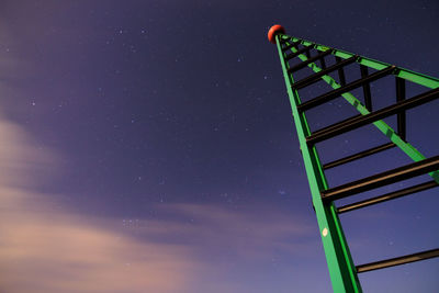 Low angle view of illuminated building against blue sky