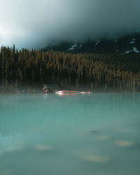 Scenic and foggy view of lake louie, canada