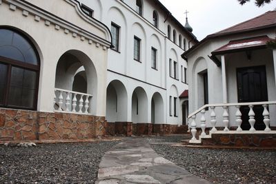 Street amidst buildings against sky