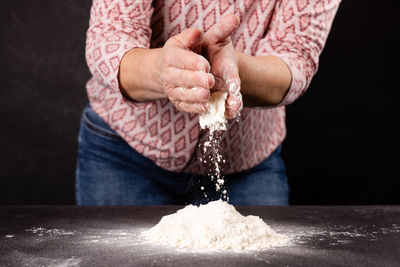 Midsection of woman holding water