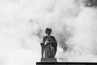 Low angle view of statue against sky