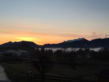 Scenic view of mountains against sky at sunset