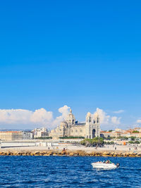 Scenic view of sea against blue sky