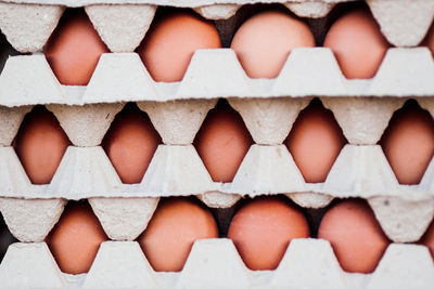 Stack of eggs in cartons for sale at market