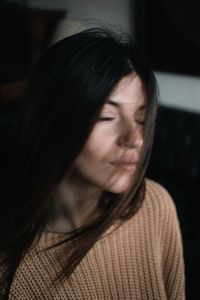 Close-up of young woman looking away