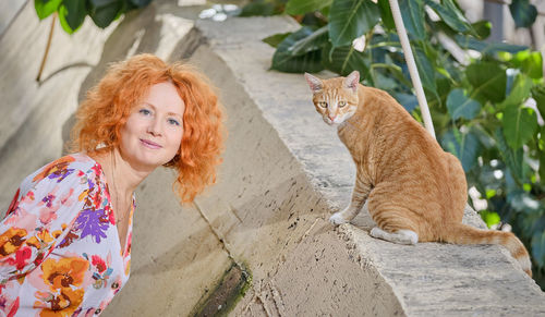 Portrait of smiling woman with cat