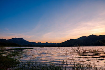 Scenic view of lake against romantic sky