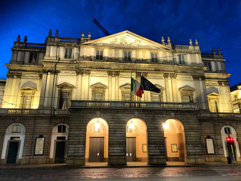 Low angle view of illuminated building at night