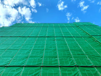 Low angle view of building against blue sky