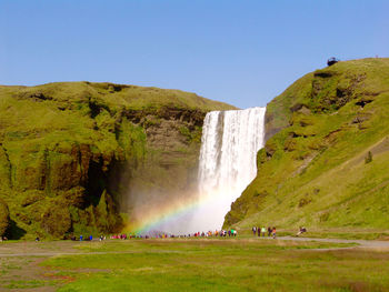 Scenic view of waterfall against clear sky