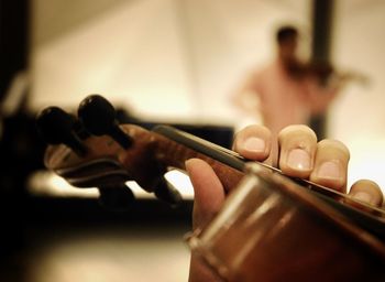 Close-up of hand holding violin