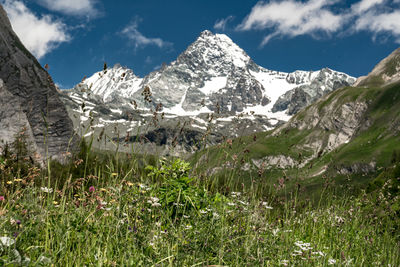 Scenic view of snowcapped mountains against sky