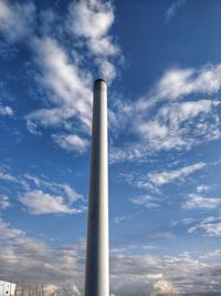 Low angle view of smoke stack against sky