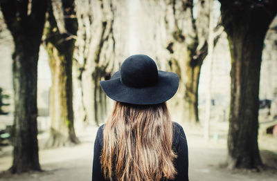 Rear view of woman with black hat