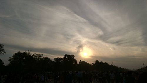 Silhouette trees against sky during sunset