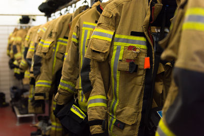 Midsection of firefighting uniforms