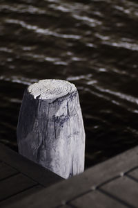 High angle view of wood on pier over lake