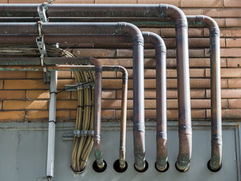 Close-up of pipes against wall