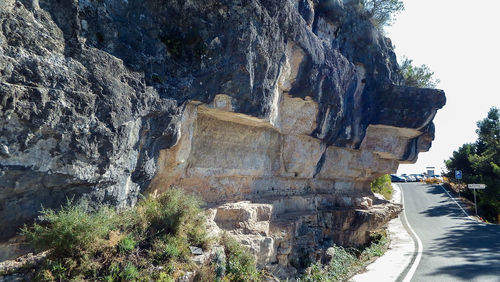 View of rock formation on road