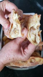 Close-up of person holding meat