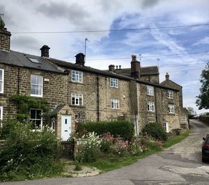 Street amidst buildings against sky