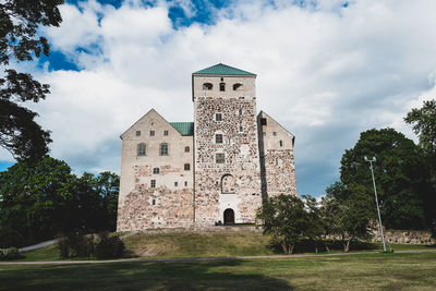 Low angle view of old building against sky