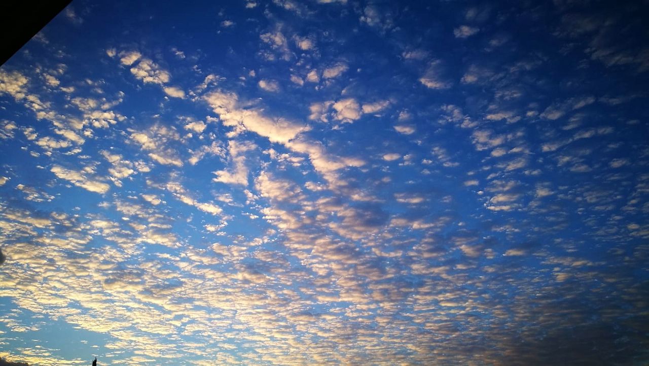 sky, cloud - sky, beauty in nature, scenics - nature, tranquility, low angle view, no people, tranquil scene, full frame, nature, blue, backgrounds, idyllic, sunset, outdoors, day, orange color, cloudscape, dramatic sky, meteorology