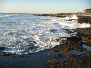 Scenic view of sea against sky during winter