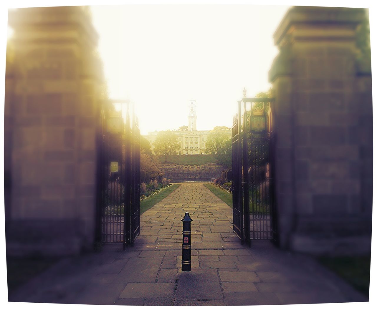 transfer print, architecture, built structure, building exterior, the way forward, sun, sunlight, auto post production filter, sunbeam, railing, cobblestone, sunset, lens flare, city, sky, footpath, sidewalk, diminishing perspective, clear sky