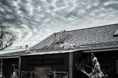 Low angle view of abandoned building against sky