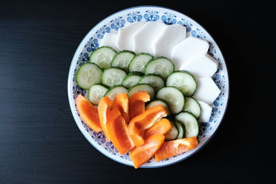 High angle view of chopped fruits in bowl