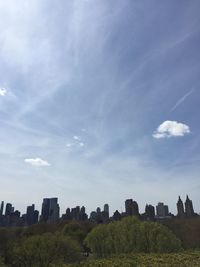 Built structure on field against cloudy sky