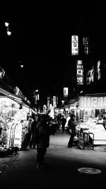 People on city street at night